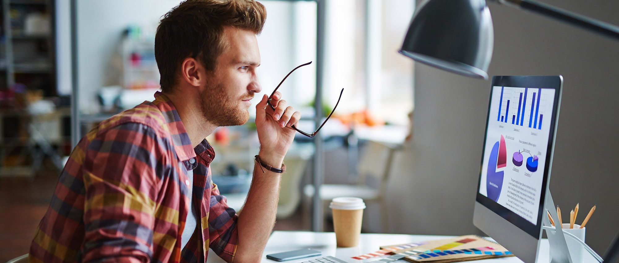 man sitting at his computer working