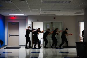 Criminal Justice students practice searching a building at Central Tech