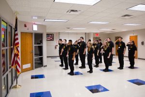 Criminal Justice students salute the American flag