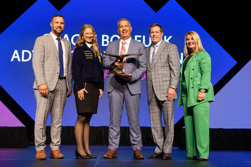 Kent Burris receiving the Bob Funk Advocacy award in 2024