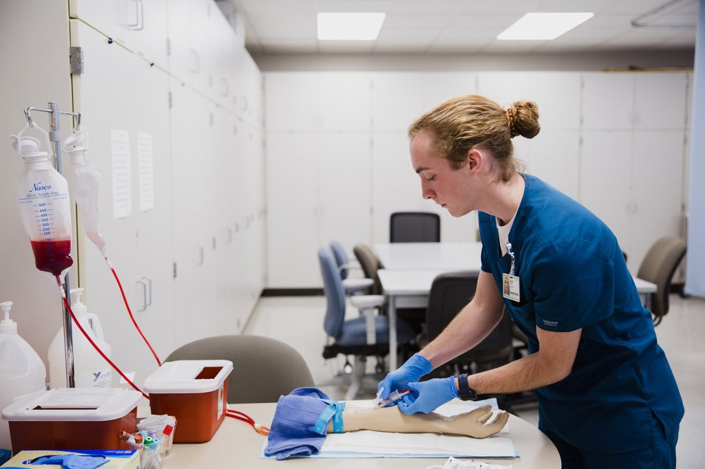 Practical Nursing student at Central Tech practicing phlebotomy