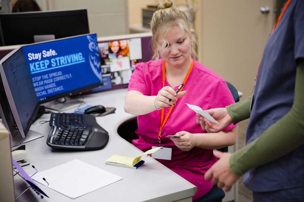 medical front office student at Central Tech in Sapulpa taking a patients payment