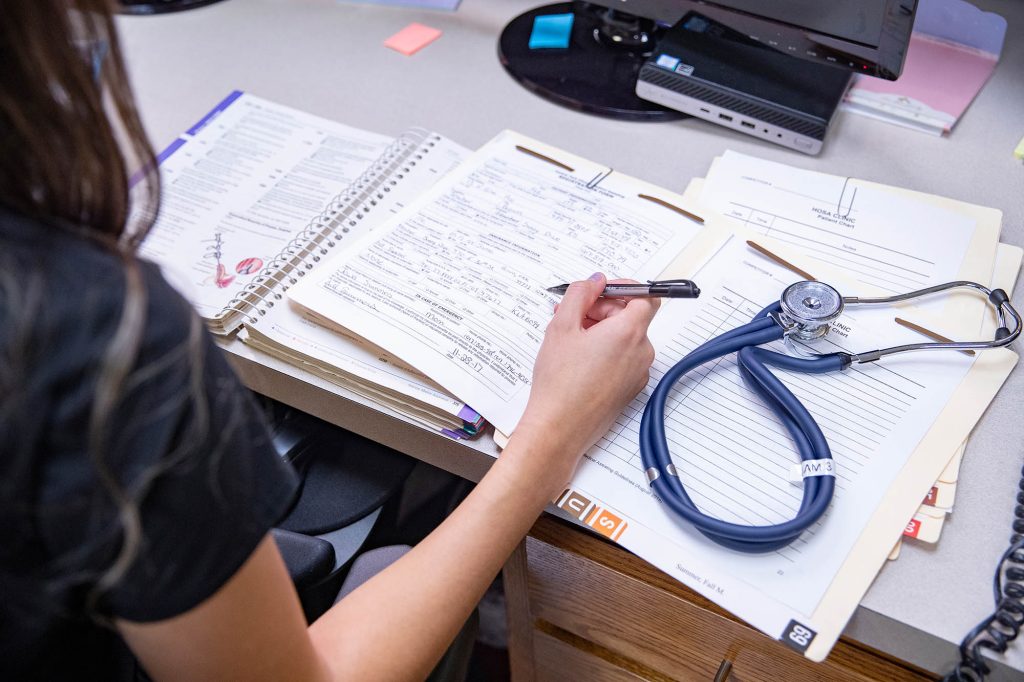 medical office student charting at Central Tech