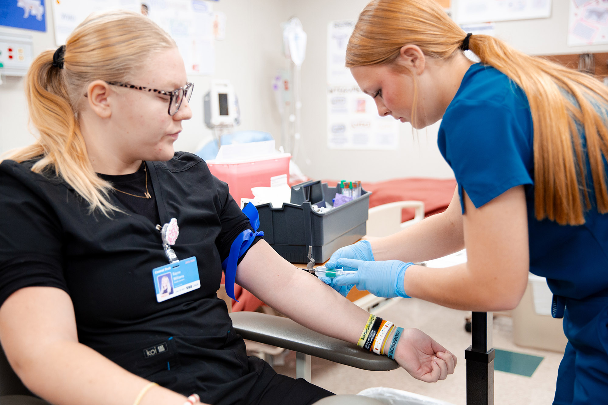 student practices blood draw at Central Tech